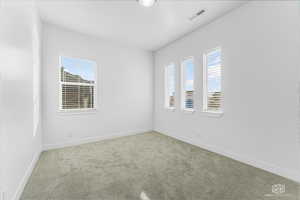 Office with carpet flooring and baseboards