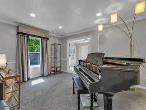 Sitting room featuring recessed lighting, carpet flooring, baseboards, and crown molding
