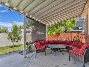 Fenced backyard with outdoor lounge area and a patio area