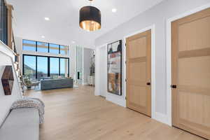 Bedroom with light wood finished floors and recessed lighting