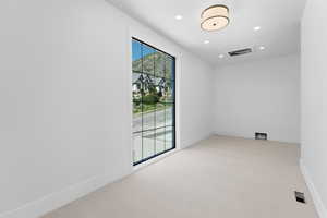 Unfurnished room featuring carpet flooring, recessed lighting, and baseboards