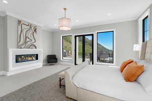 Bedroom with carpet flooring, ornamental molding, recessed lighting, baseboards, and access to exterior
