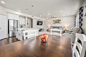 Dining area with recessed lighting, dark wood-style floors, a ceiling fan, and a textured ceiling