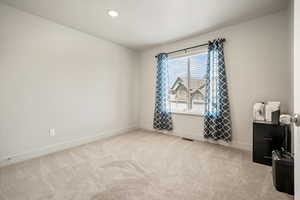 Bedroom 3  featuring carpet floors, baseboards, recessed lighting, and an office area
