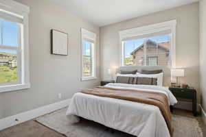Carpeted bedroom with baseboards