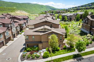 Aerial view of residential area with a mountainous background
