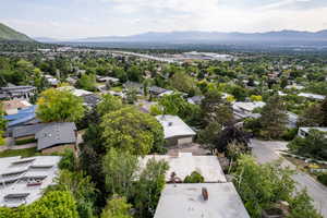 Aerial view of residential area featuring a mountainous background
