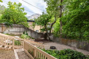 Fenced backyard featuring a mountain view