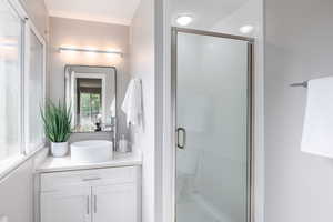 Full bath featuring vanity and a stall shower