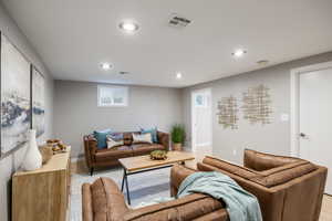 Living area featuring recessed lighting, light wood-type flooring, and baseboards