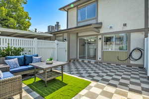 View of patio / terrace featuring outdoor lounge area and a gate