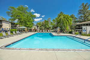 Community pool with a gazebo and a patio