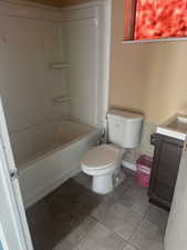 Full bathroom with vanity, shower / washtub combination, and tile patterned floors