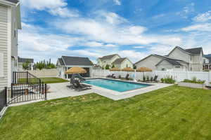 View of pool featuring a residential view, a patio area, an outdoor structure, and an exterior structure