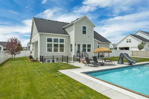 Rear view of house featuring a patio, a shingled roof, entry steps, and central air condition unit