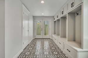 Mudroom with baseboards, french doors, and recessed lighting