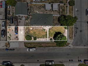 Aerial view of property and surrounding area with property parcel outlined