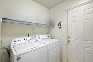 Laundry area with washing machine and clothes dryer