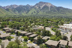 View of mountain backdrop featuring nearby suburban area