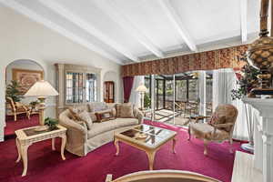 Living area featuring a textured ceiling and carpet