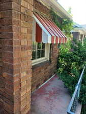 View of side of property featuring brick siding