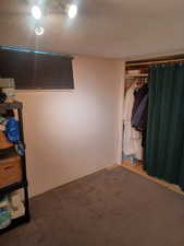 Unfurnished bedroom featuring carpet
