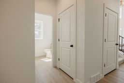 Corridor with light wood-type flooring