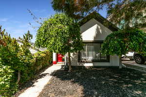 View of front of property featuring stucco siding