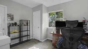 Office with carpet floors and baseboards