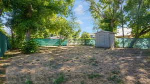 View of fenced backyard