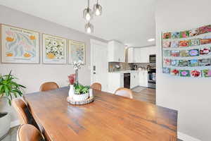 Dining area with baseboards and light wood-type flooring