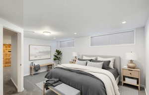 Bedroom with carpet flooring, recessed lighting, and baseboards