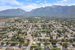 Aerial perspective of suburban area with a mountainous background