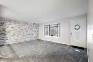 View of carpeted entrance foyer