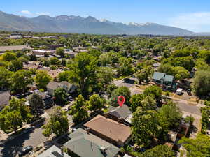 Aerial perspective of suburban area with a mountainous background