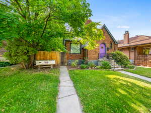 View of front of house featuring brick siding