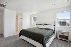 Bedroom with carpet, multiple windows, baseboards, and recessed lighting
