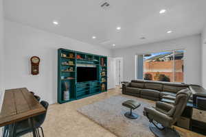 Living room featuring recessed lighting and baseboards