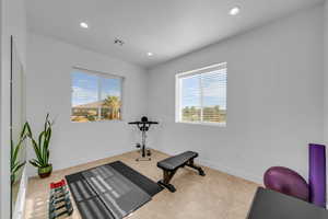 Exercise room featuring recessed lighting and baseboards
