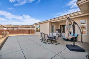 Fenced backyard featuring a patio and outdoor dining space