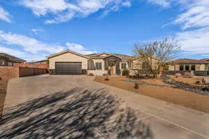 View of front of home featuring stone siding, stucco siding, and a tiled roof