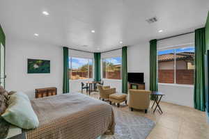 Bedroom featuring light tile patterned flooring, recessed lighting, and baseboards