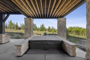 View of patio / terrace featuring a covered hot tub