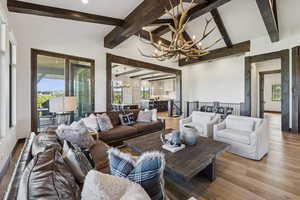 Living room with a chandelier and wood finished floors