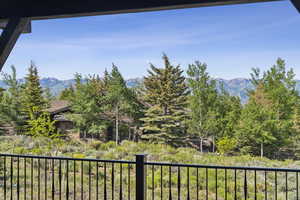 View of yard featuring a mountain view and a balcony