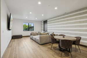 Living room featuring recessed lighting, light wood finished floors, and baseboards