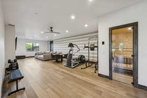 Exercise area with ceiling fan, recessed lighting, wood finished floors, and baseboards