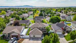 Aerial perspective of suburban area with a mountain backdrop