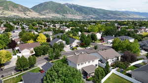 Aerial perspective of suburban area featuring a mountain backdrop