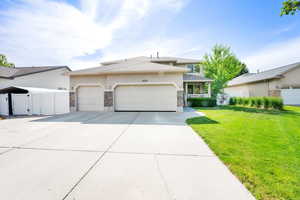 Large concrete driveway with parking spaces for up to 6 cars
